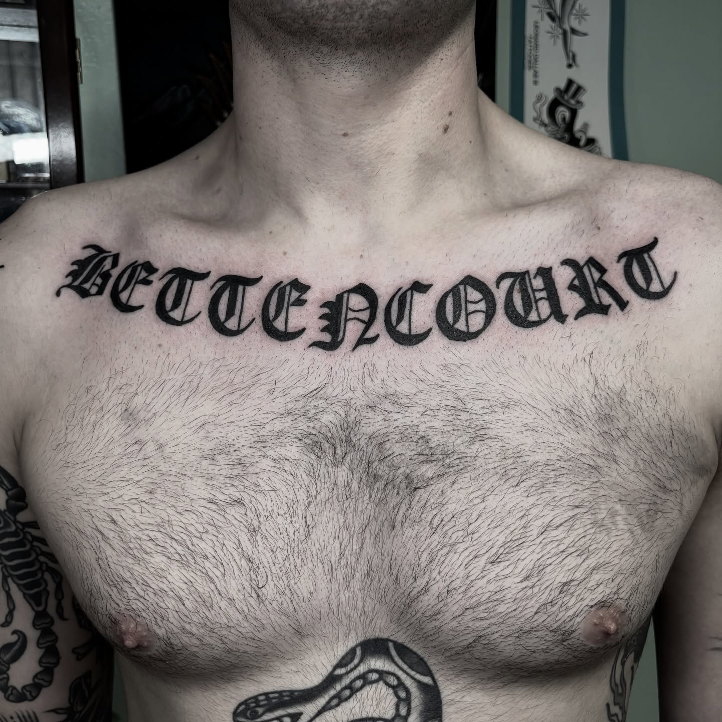 BETTENCOURT lettering script tattoo on the chest by π³πππ πΆπππππ