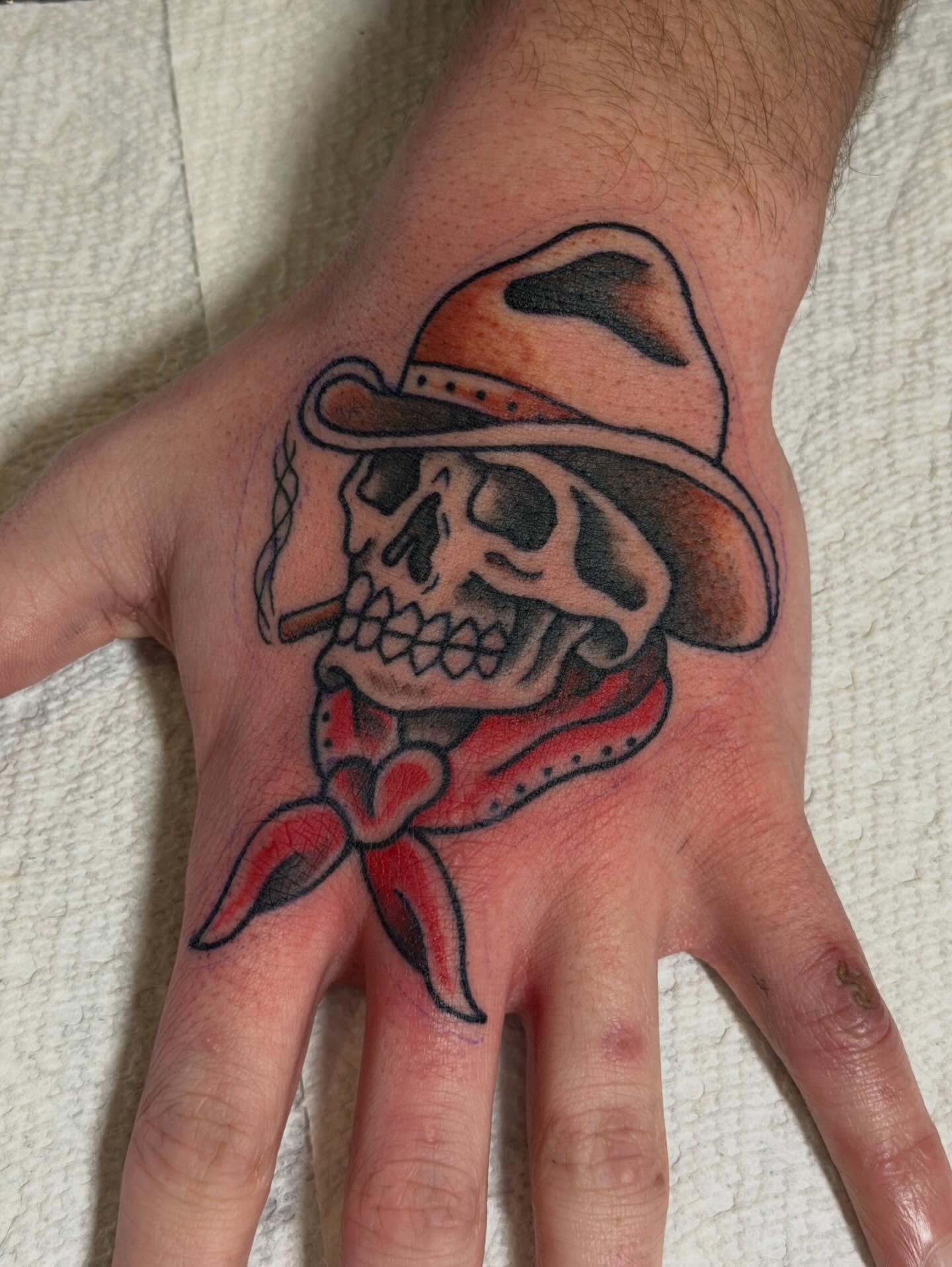 Cowboy skull American traditional tattoo on the hand by Sophia, New Carlisle, Ohio