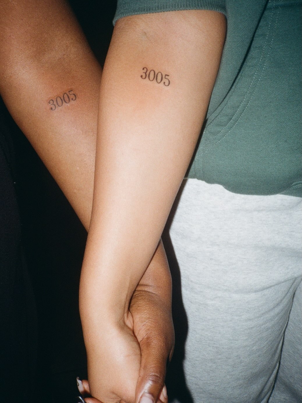 Number lettering script tattoo on the forearm by Jazz Walker