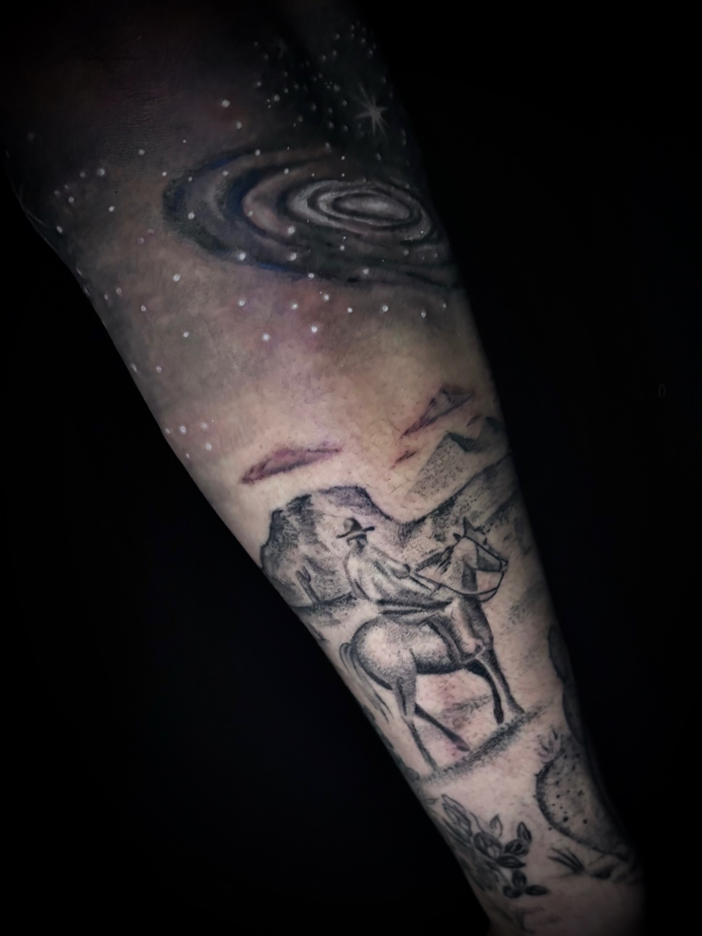 Astronaut and galaxy dotwork tattoo on the forearm by Tattoos by Marcy