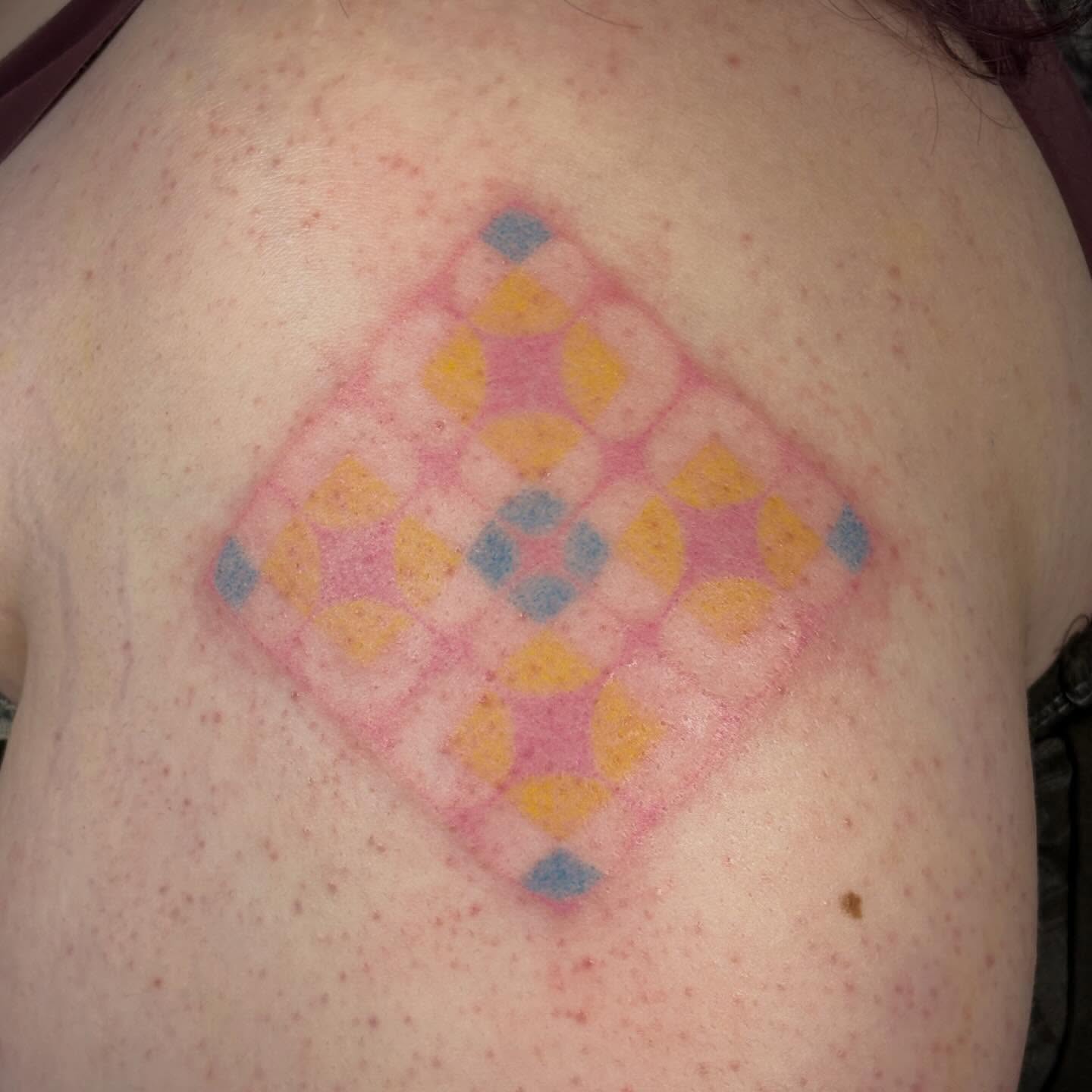 Geometric pattern geometric tattoo on the back by Jill