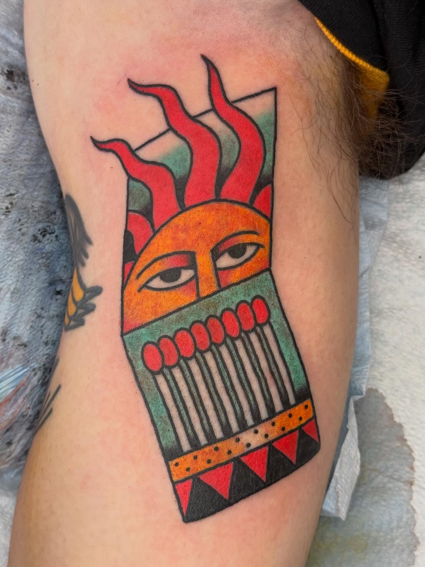Sun with flames American traditional tattoo on the forearm by Emma Eaton