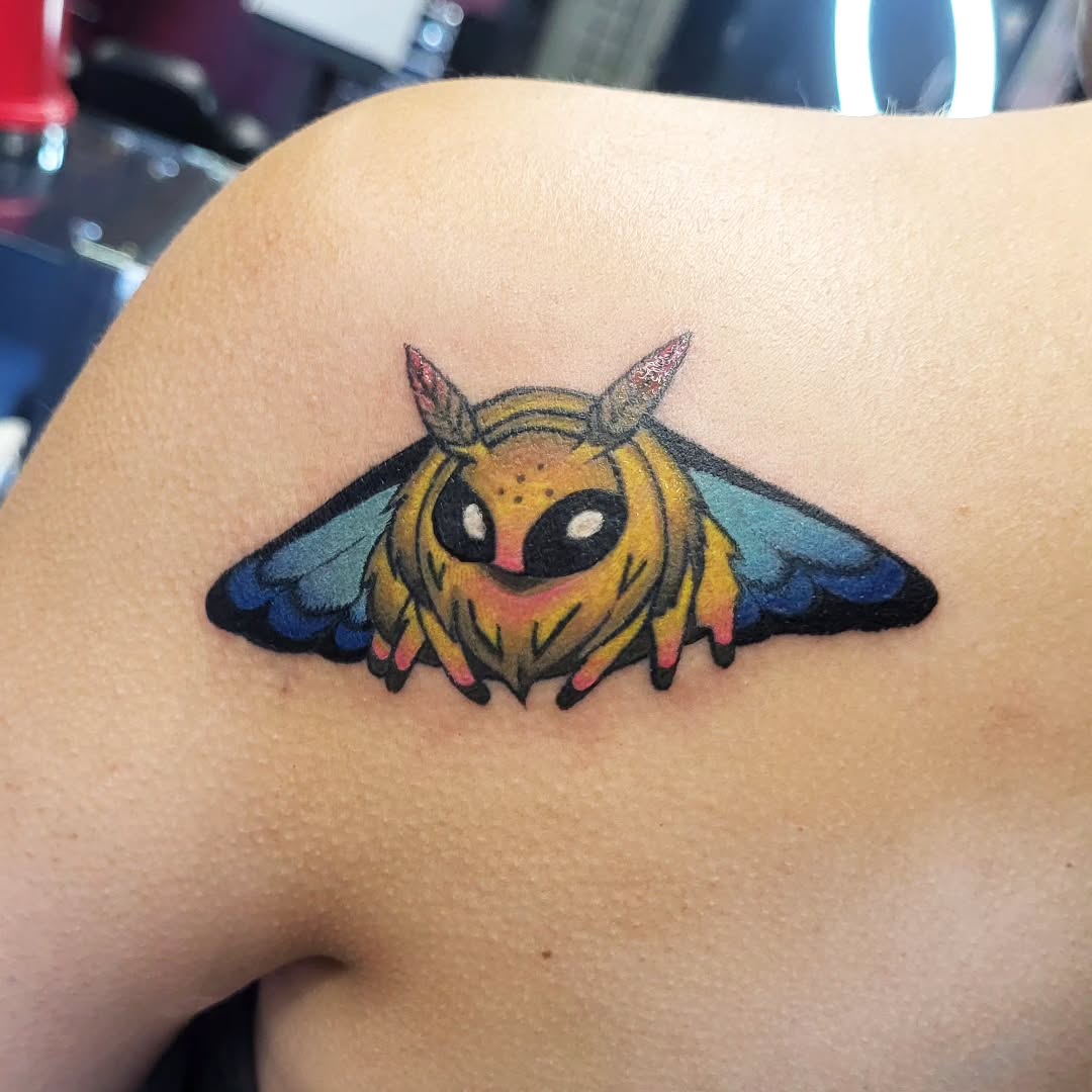 Moth character fine line tattoo on the shoulder by TEA ☕️ Tattoos