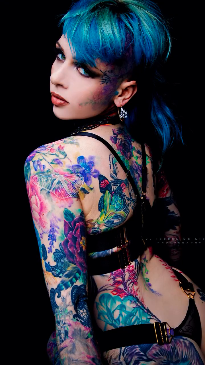 Woman with floral and abstract tattoos neo-traditional tattoo by Colorful Tattoos by Cody Dean