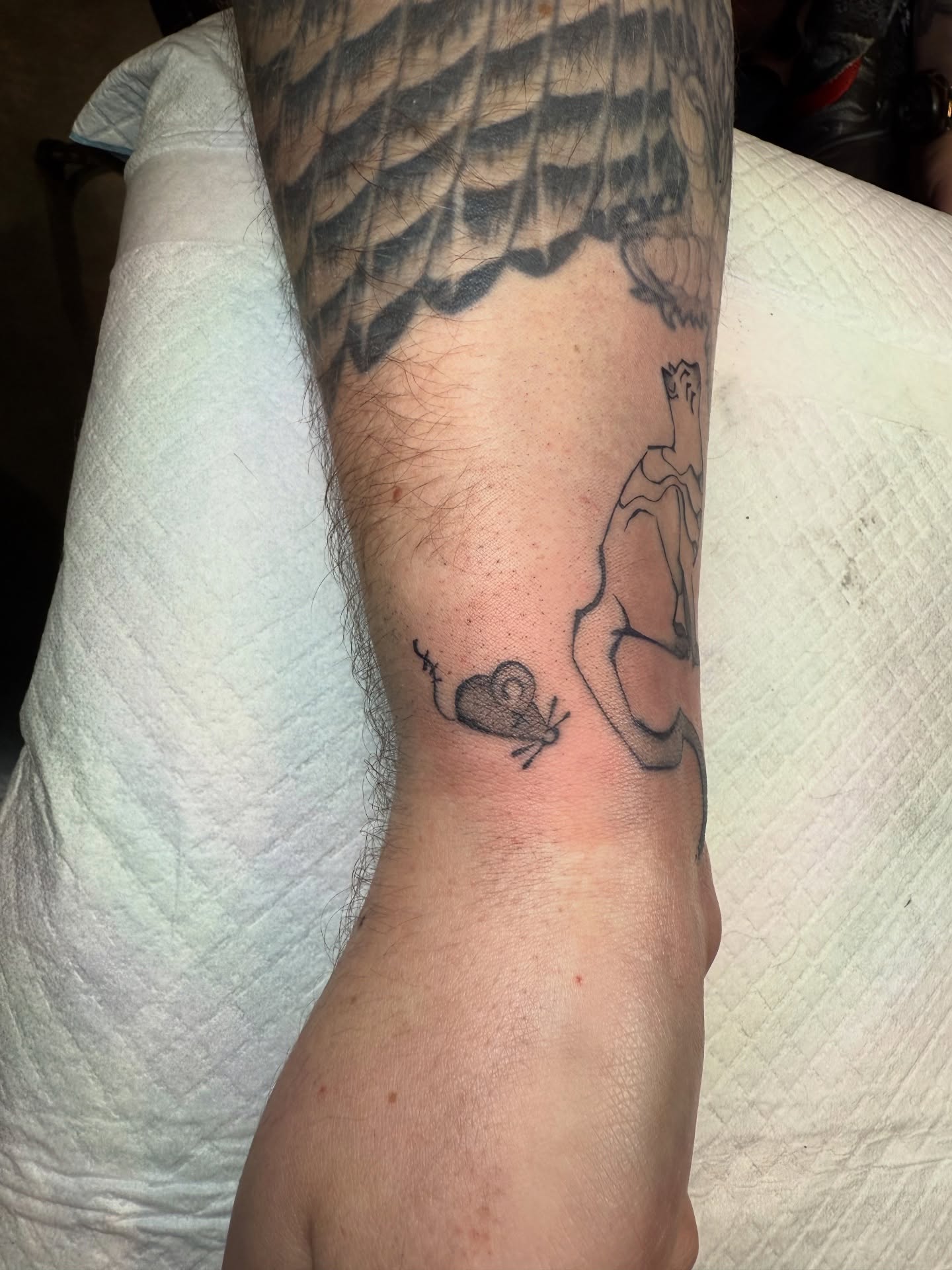 Bird and heart black and grey tattoo on the forearm by z o y a, Seattle, Washington