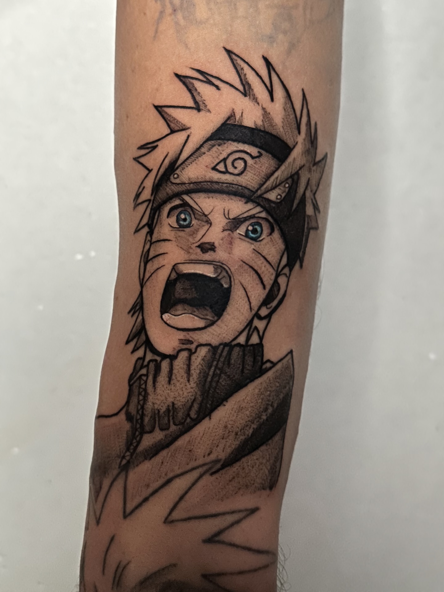 Naruto anime tattoo on the forearm by Messias Tattoo Artist
