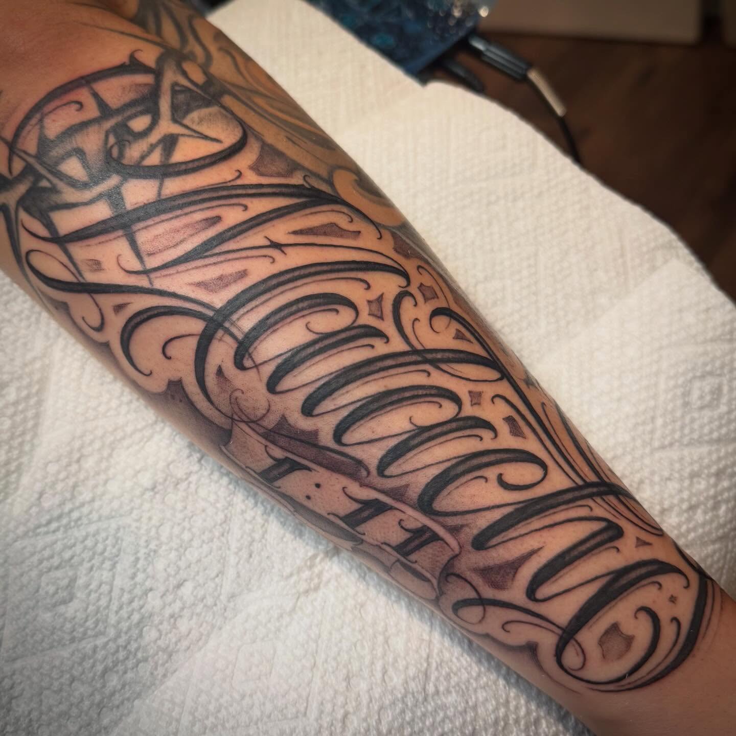 Tattoo by @tattoosbyskip — lettering_script