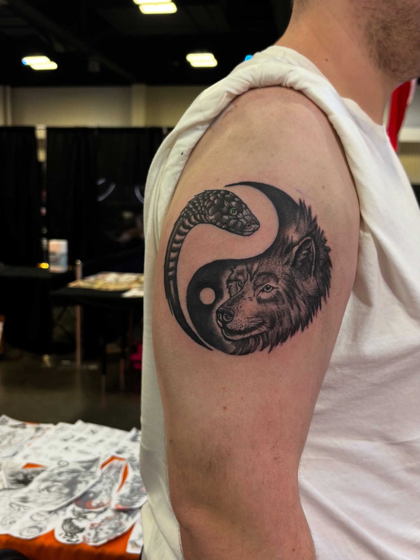 Wolf and snake realism tattoo on the shoulder by Nyah Ramirez