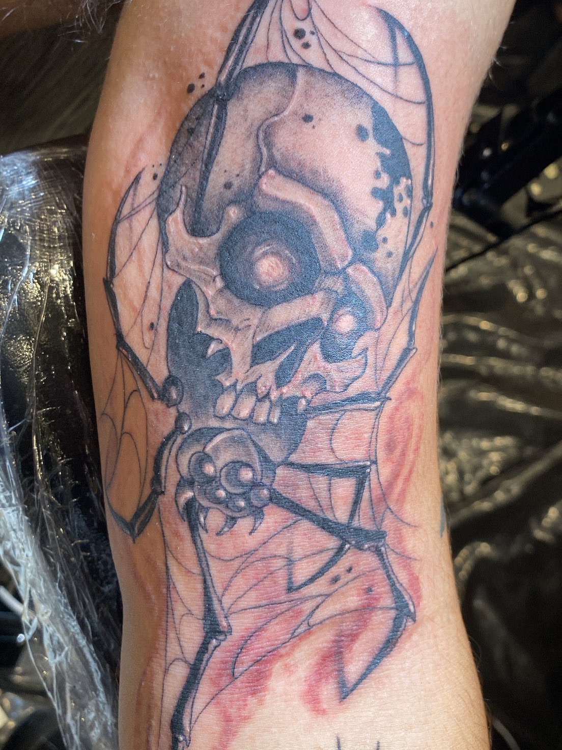 Cyborg skull dark realism tattoo on the forearm by Hecho En El Bronx