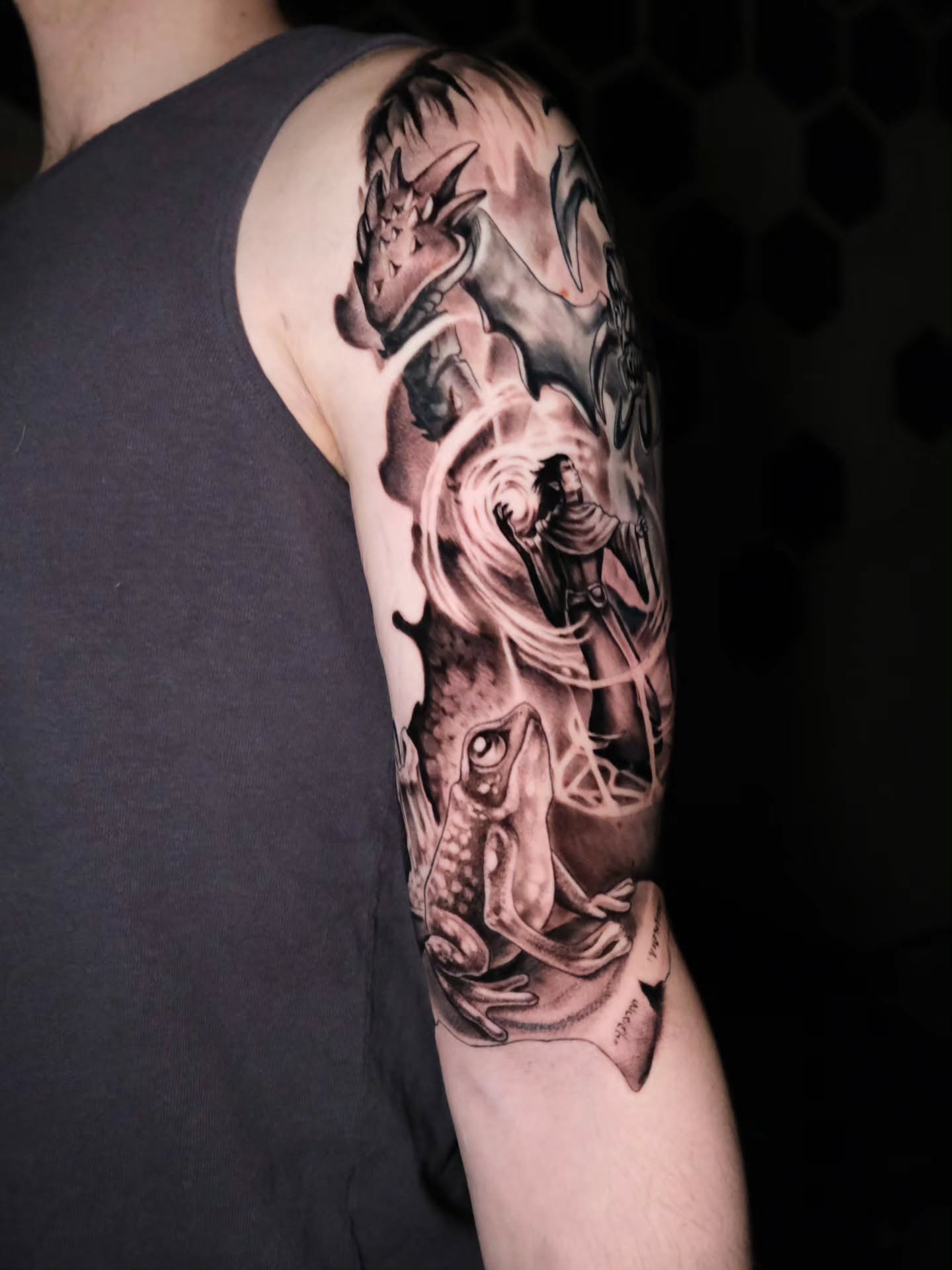 Fish and dragon realism tattoo on the upper arm by Tash  - Seattle Tattoo Artist