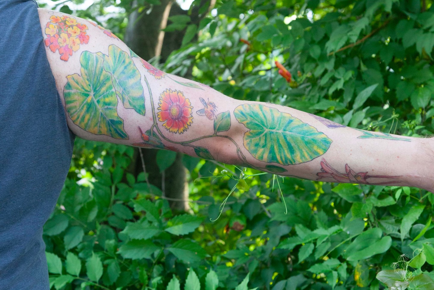 Lotus leaves and flowers new school tattoo on the forearm by Nashville Piercer & Tattoo Artist ✨ Quinne