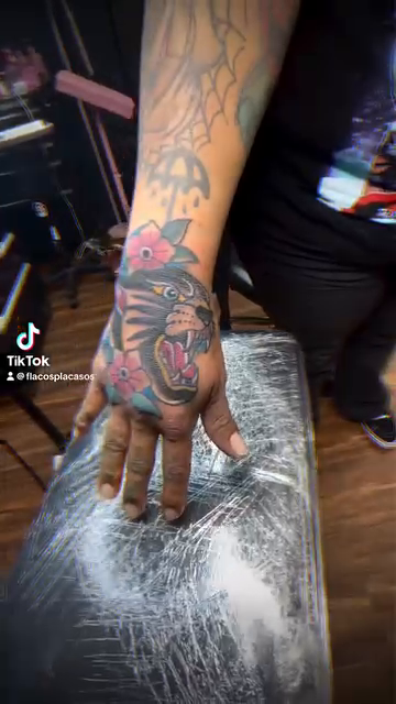 Panther and flowers neo-traditional tattoo by Eli Flores