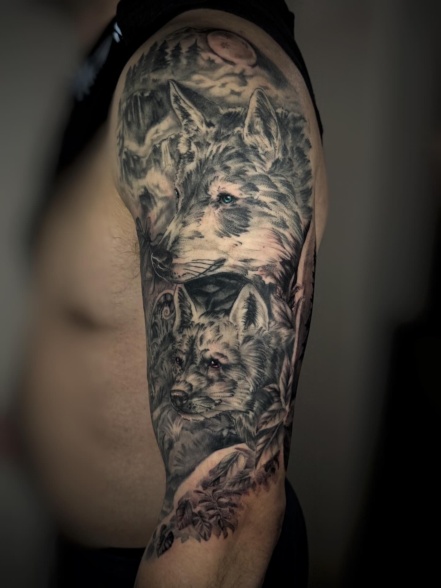 Wolves realism tattoo on the forearm by Anna Saveria