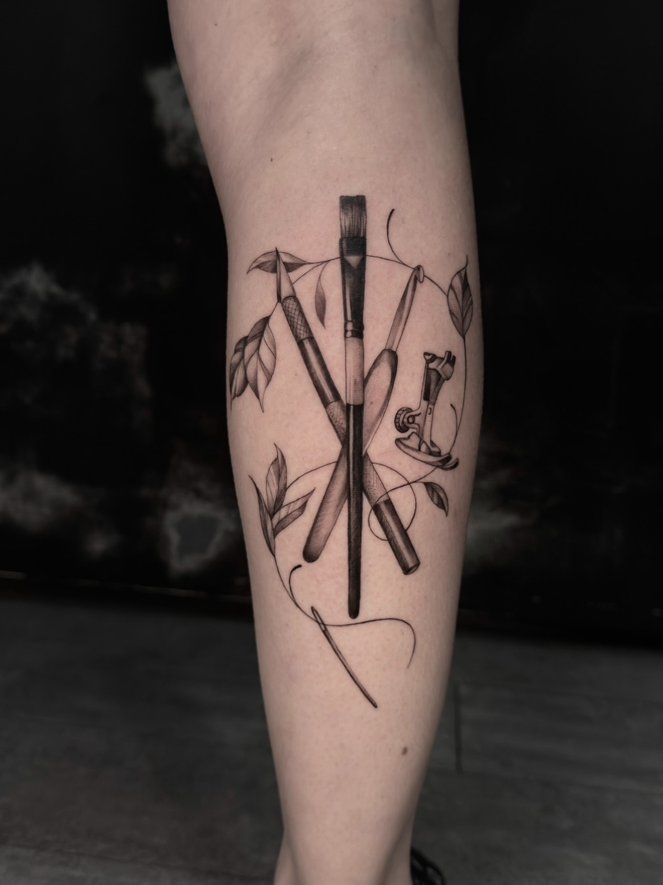 Paintbrushes and leaves realism tattoo on the forearm by Mel K Lockett - Nashville Tattoo Artist
