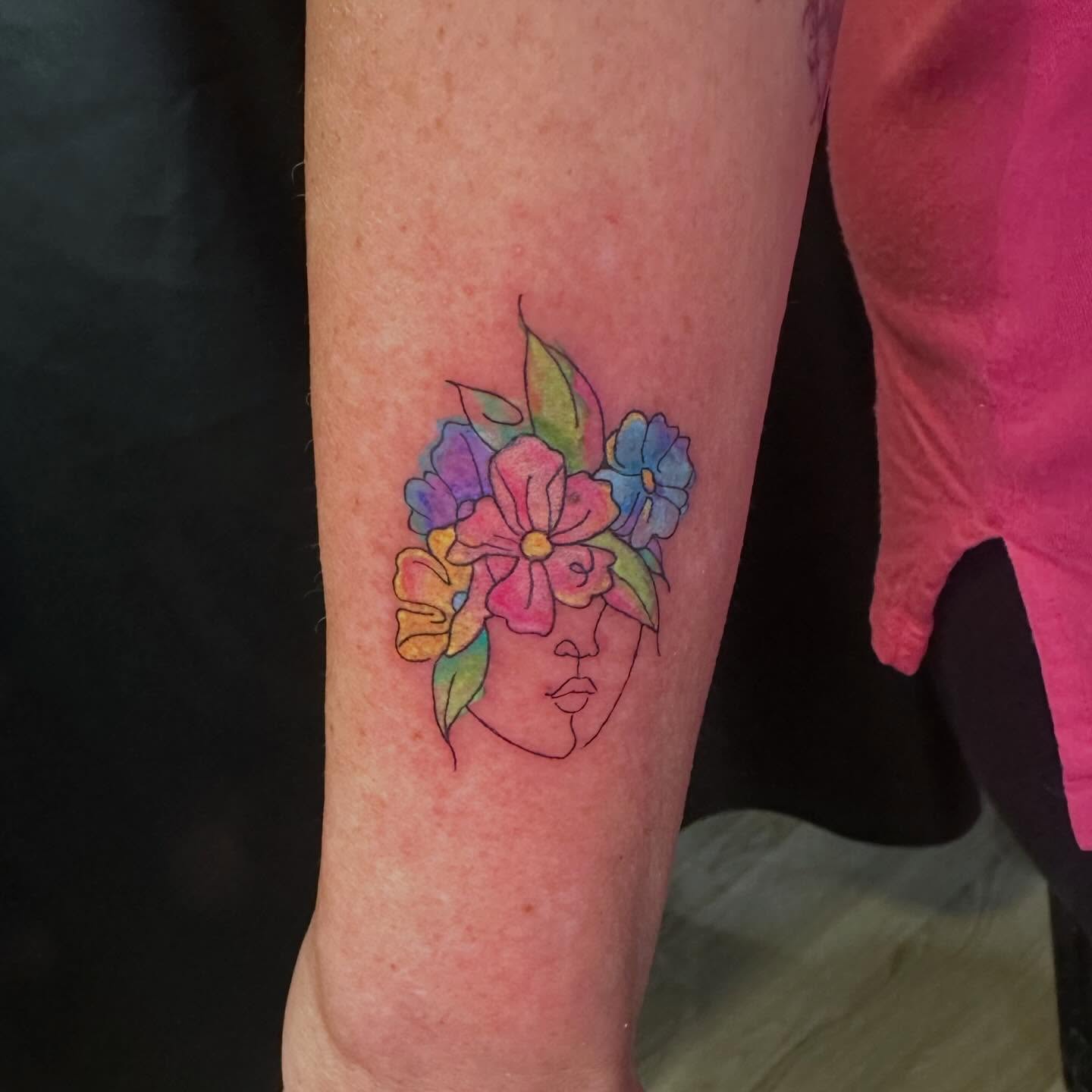 Floral mask watercolor tattoo on the forearm by Sam, Mount Laurel, New Jersey