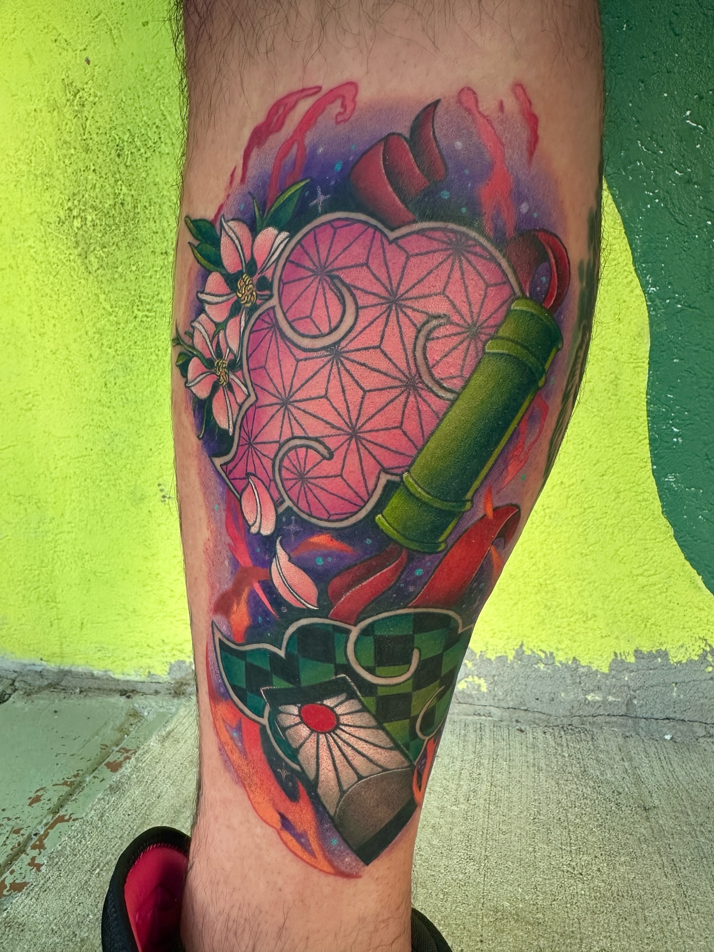 Geometric heart with flowers geometric tattoo on the forearm by Holle Hellfire