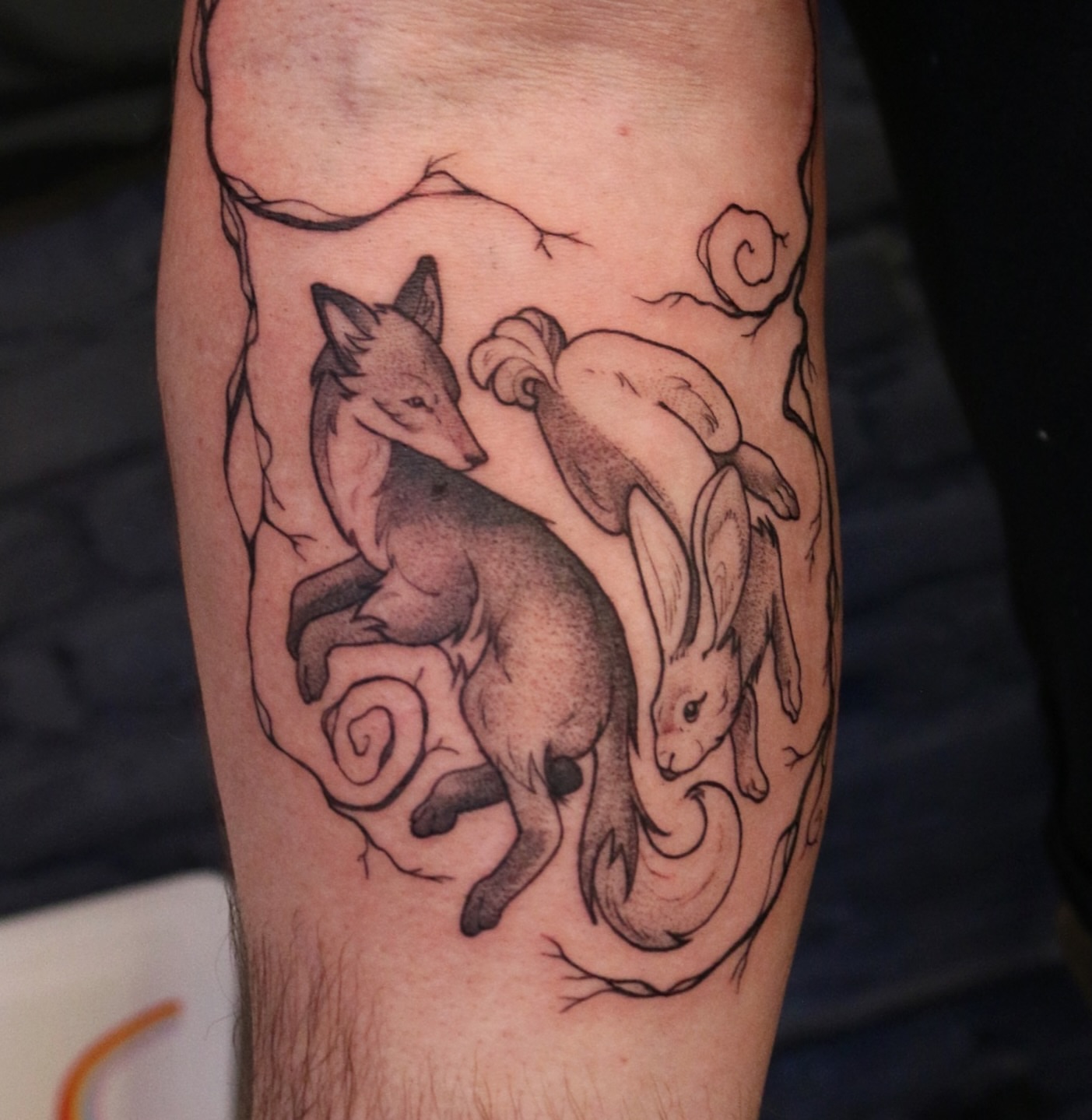 Fox and rabbit realism tattoo on the forearm by Summer Balcom M.