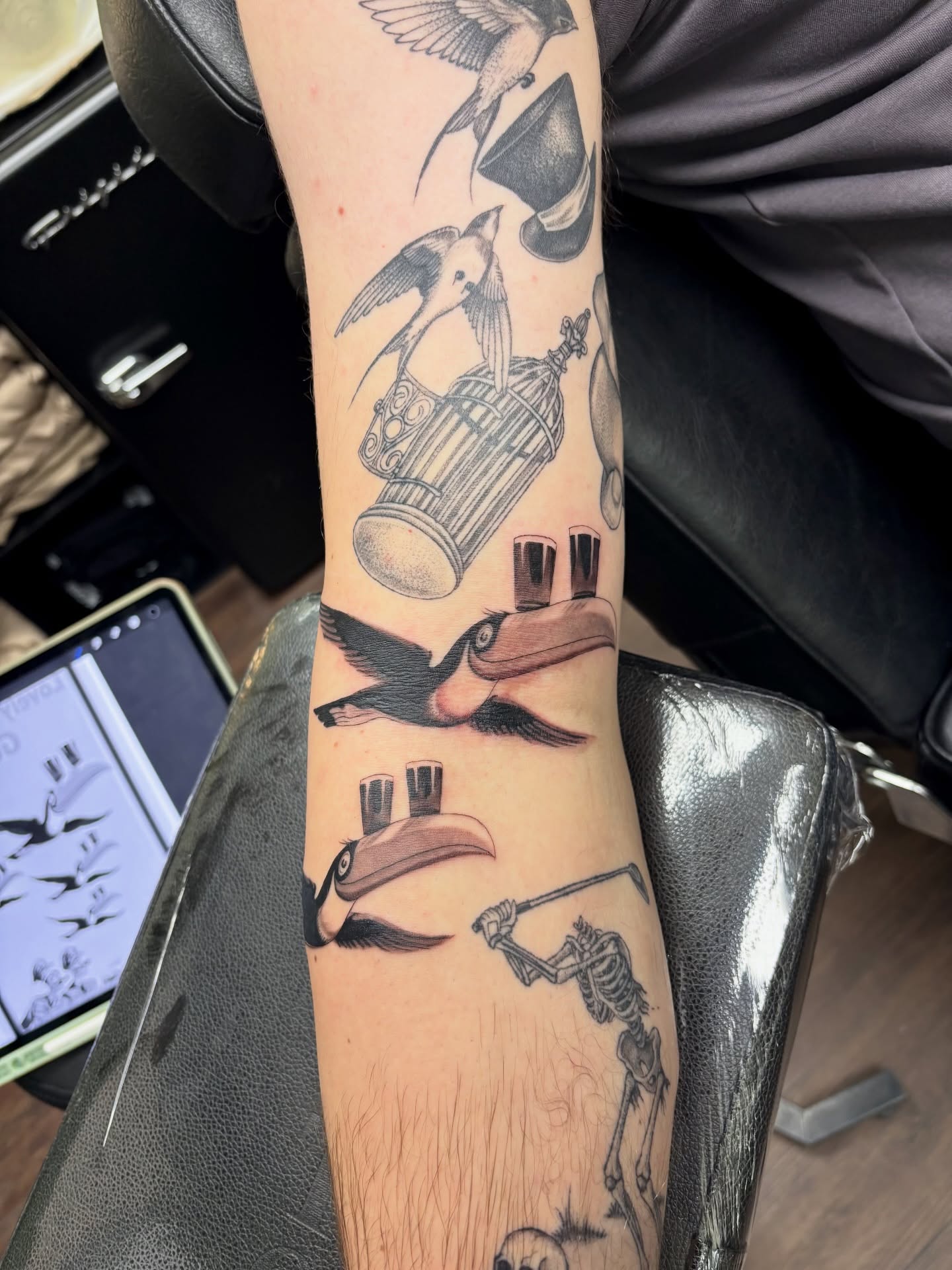 Bird and cage neo-traditional tattoo on the forearm by sydney honn