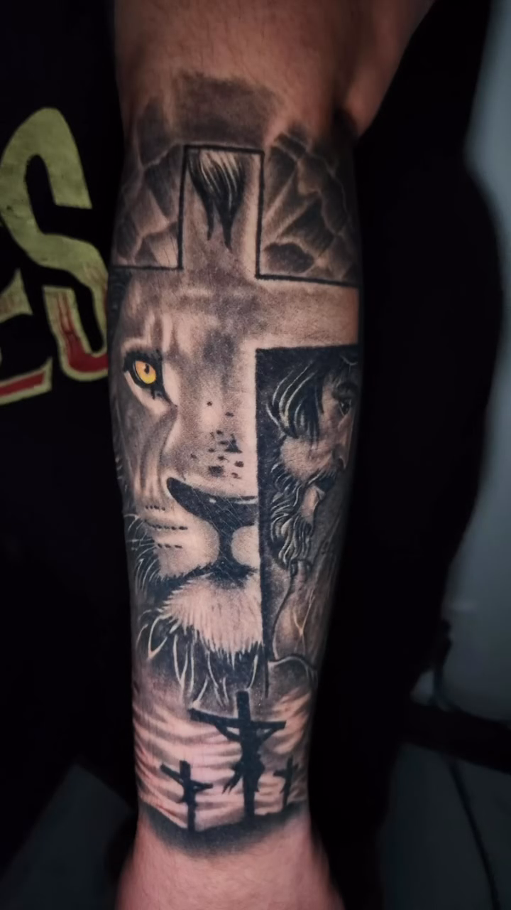 Lion and cross realism tattoo by professional tattoo artist
