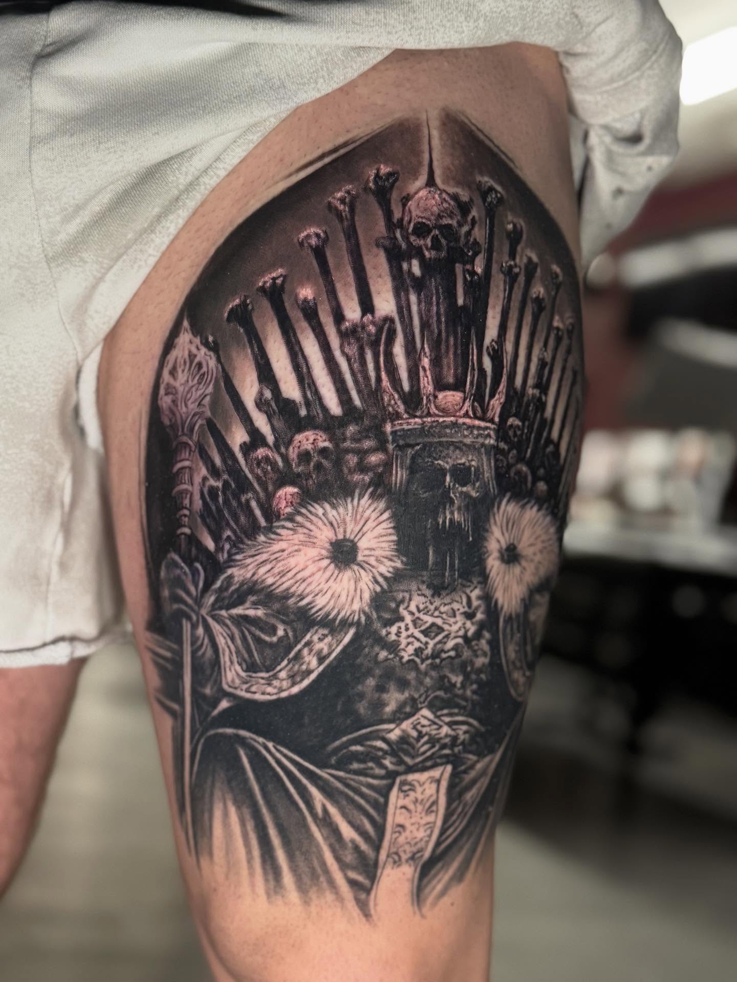 Crown and skulls dark realism tattoo on the thigh by Shawn Skale