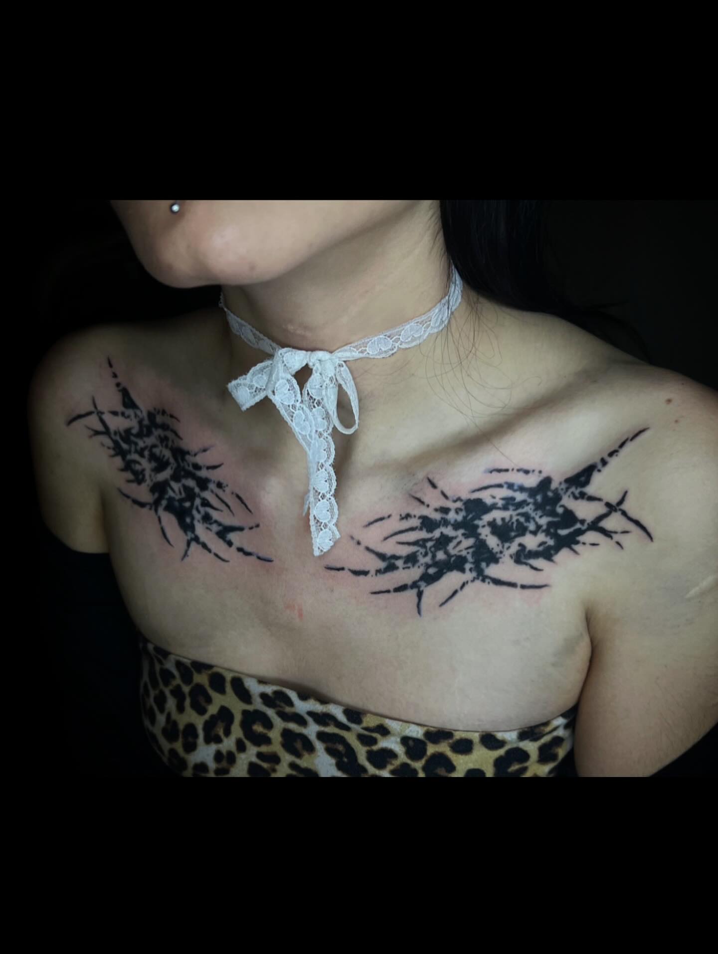 Abstract splatter black and grey tattoo on the chest by @halfwit__