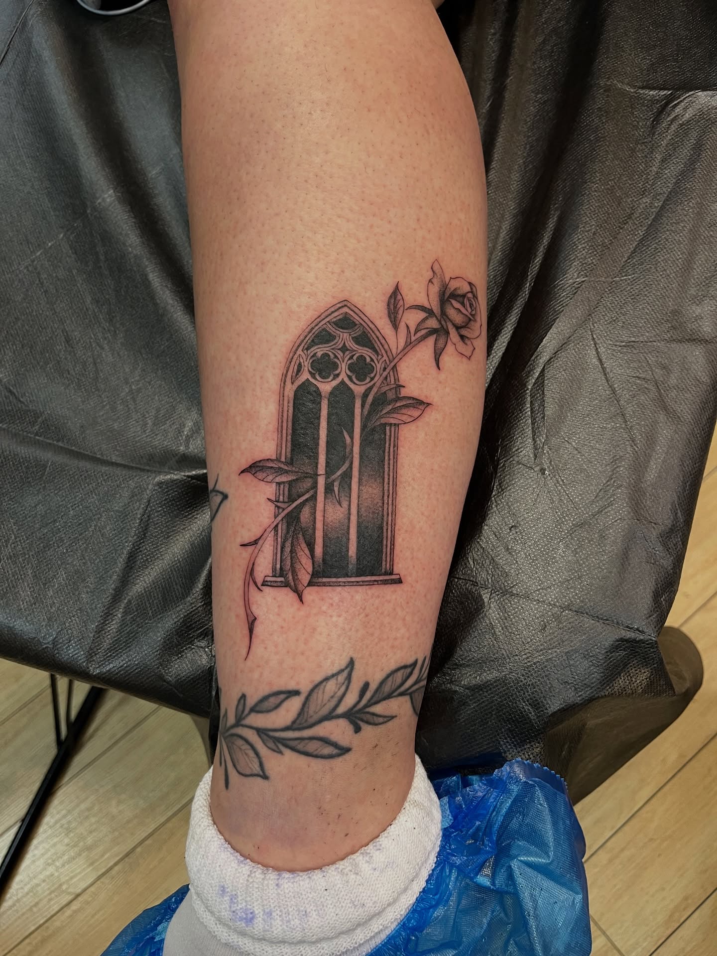 Gothic window and rose realism tattoo on the forearm by Winston Thai