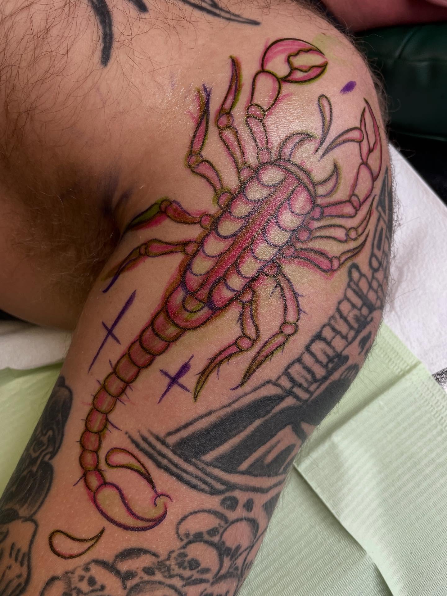 Scorpion American traditional tattoo on the upper arm by Micheal McGlinchey