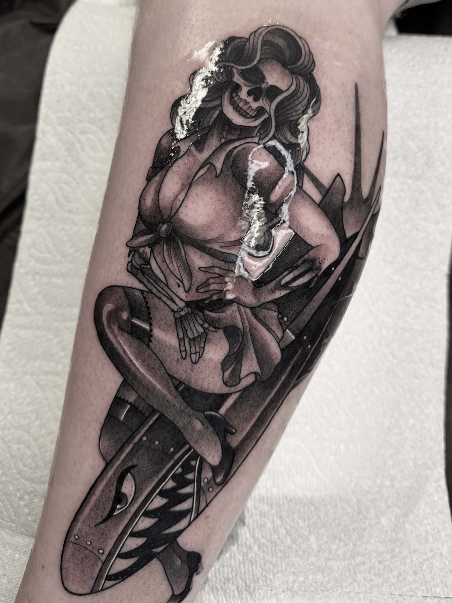 Female skeleton riding motorcycle realism tattoo on the forearm by Anne Cornelson