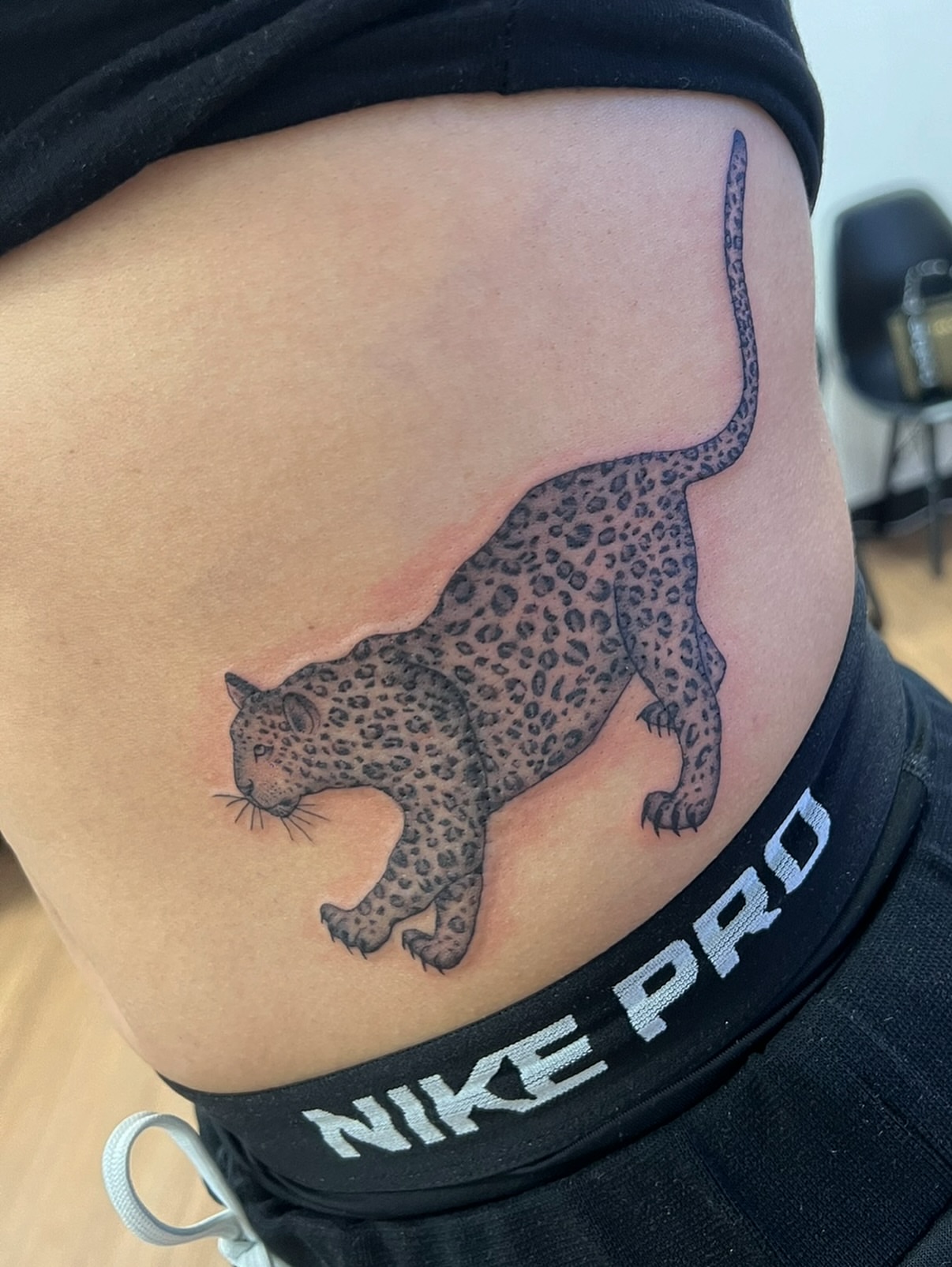 Leopard black and grey tattoo on the thigh by Royal Martinez