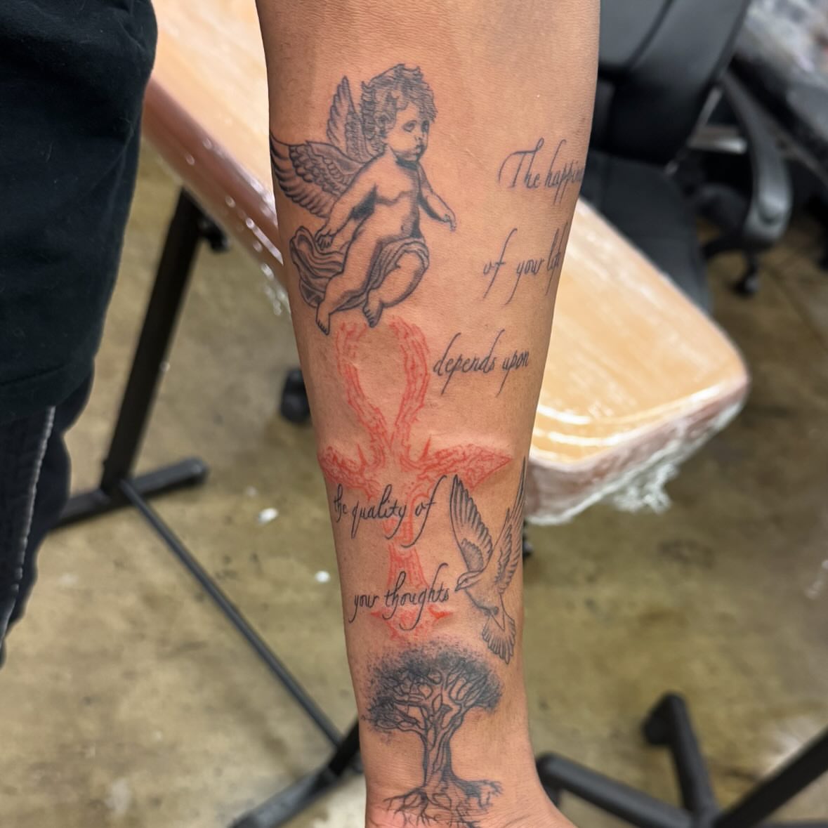 Cherub and dove neo-traditional tattoo on the forearm by Willi Tattoos👹