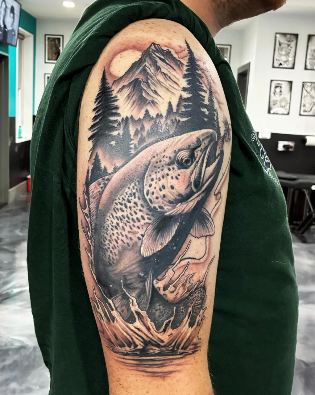 Trout jumping realism tattoo on the forearm by Adam Silfies