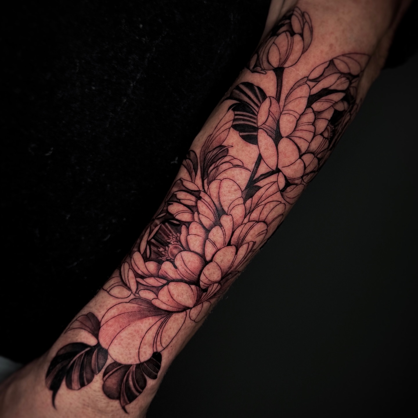 Floral bouquet black and grey tattoo on the forearm by Becky Lee Cameron