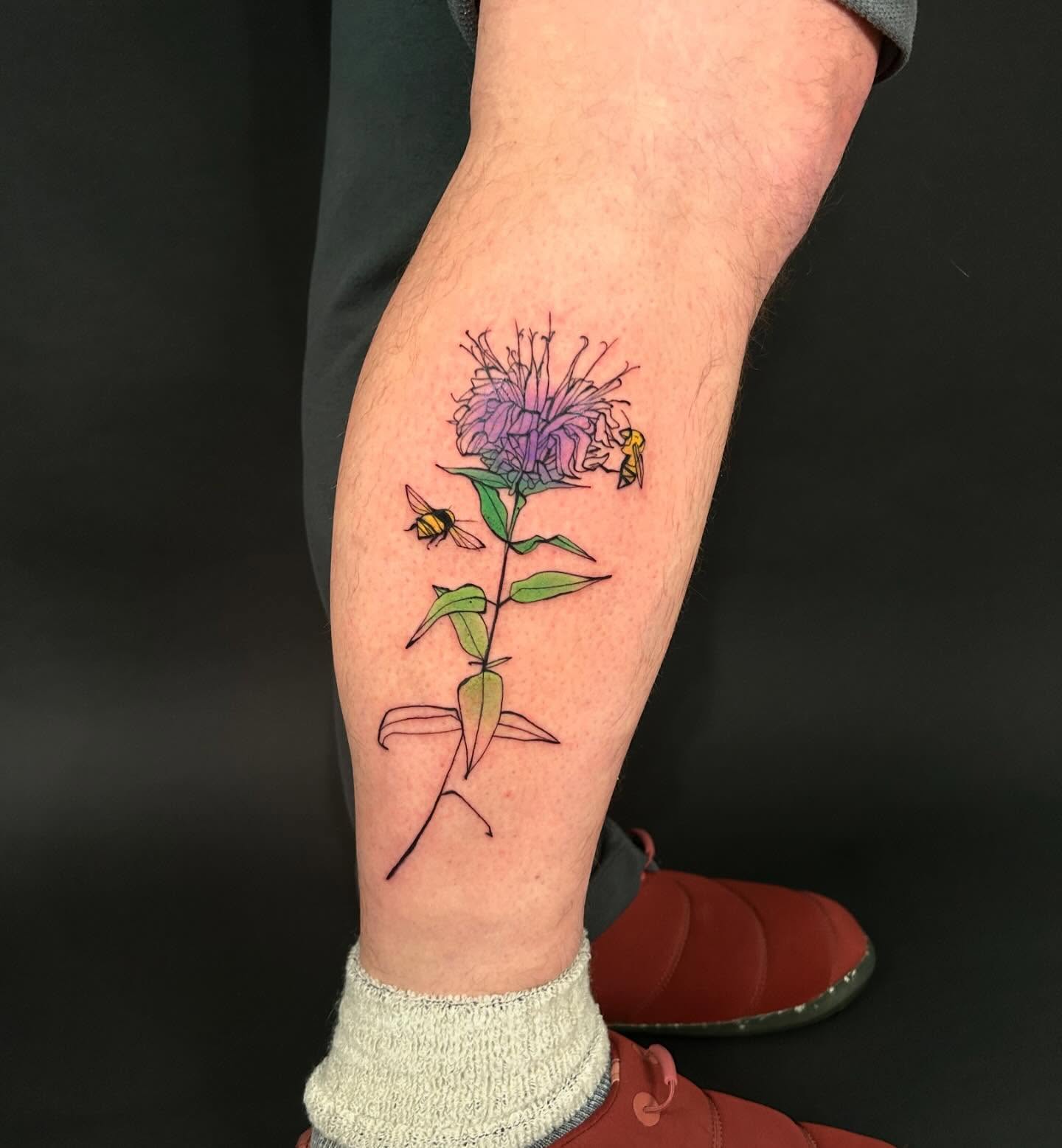 Flower and bees illustrative tattoo on the forearm by @laurabochet_tattoo, Beacon, NY