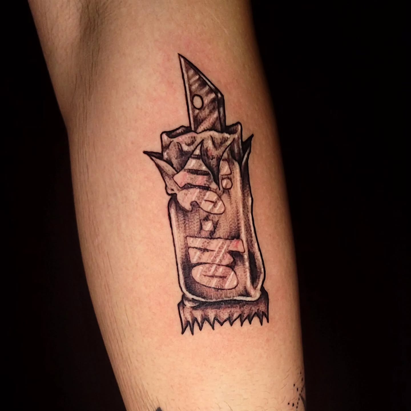 Utility knife black and grey tattoo on the forearm by Tyler Monty