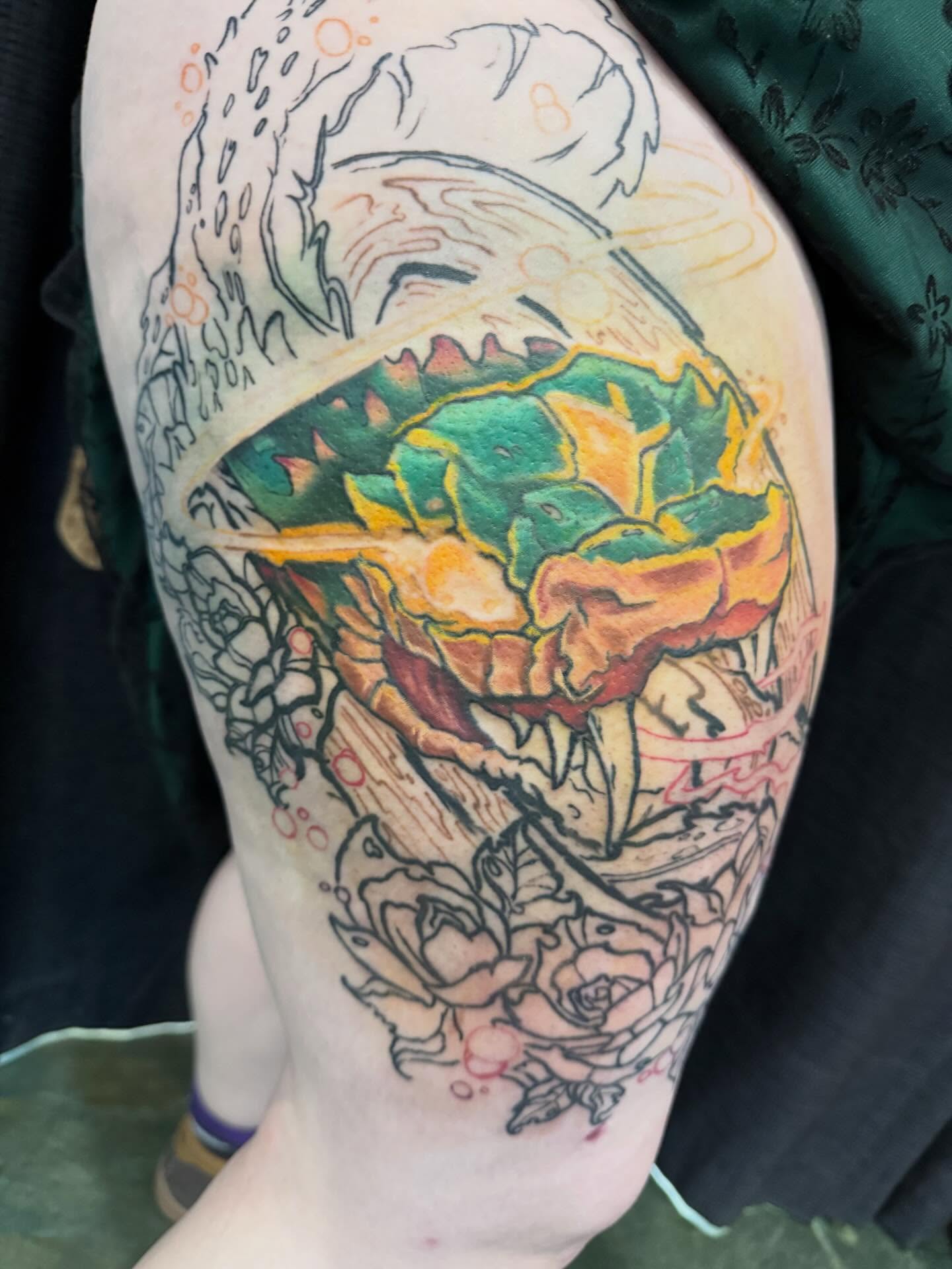 Chameleon and roses new school tattoo on the thigh by Devon Beyer, Mission, Kansas
