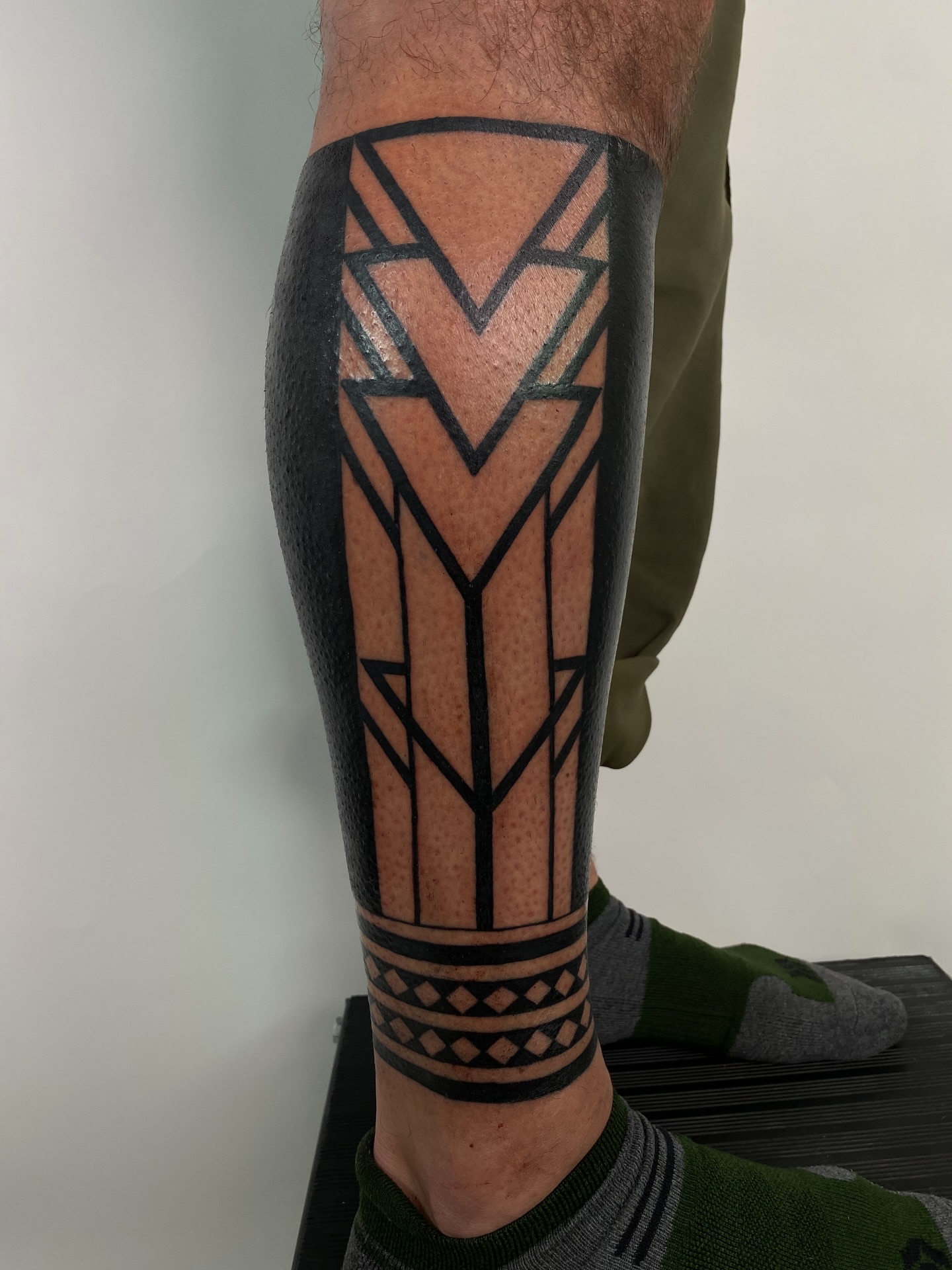 Geometric design geometric tattoo on the calf by Dave Rodriguez