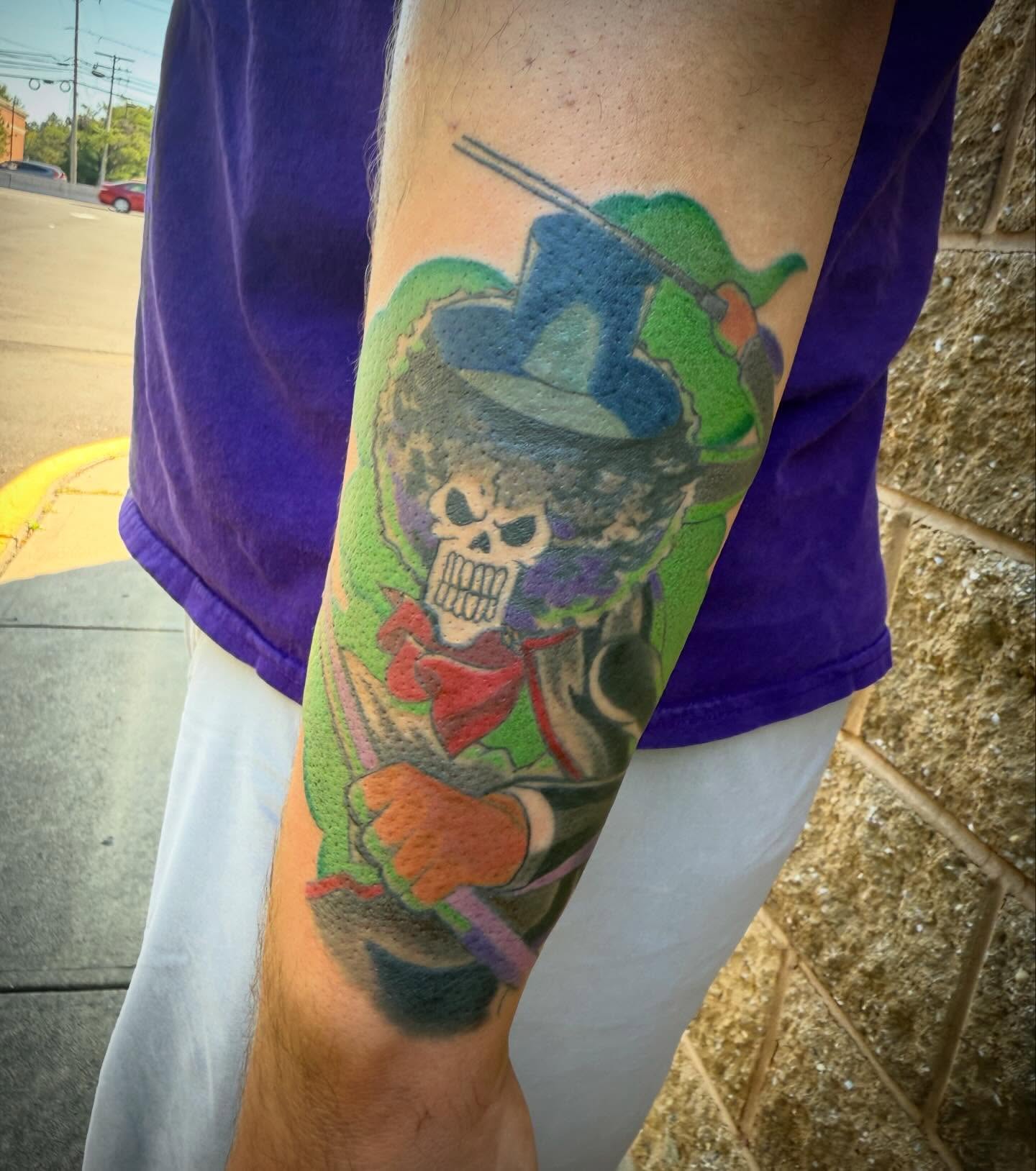 Jester skull American traditional tattoo on the forearm by Abby Hofman
