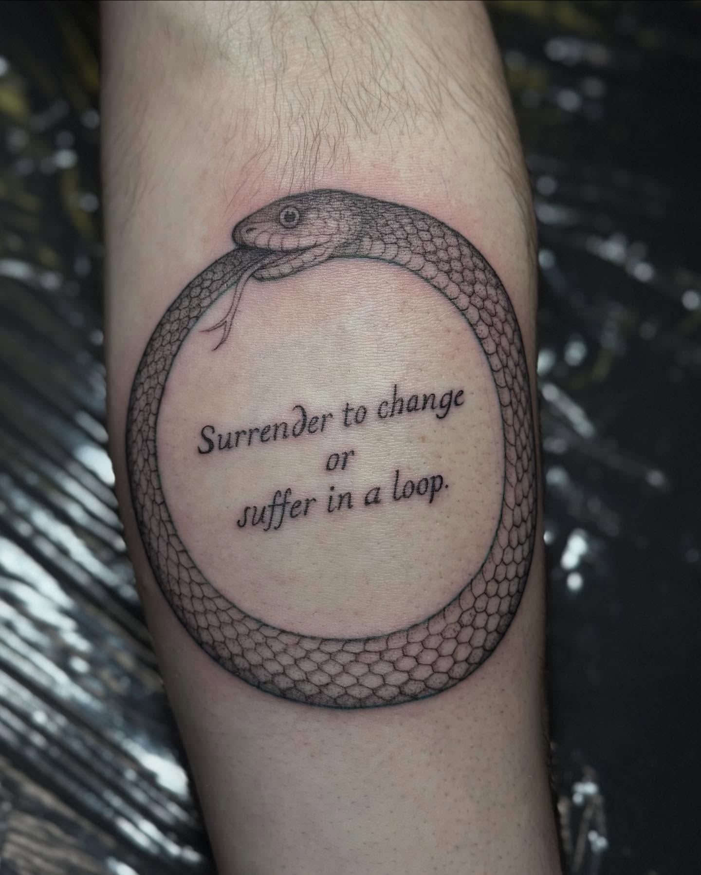 Snake and phrase black and grey tattoo on the forearm by Carson Mccullers ✨