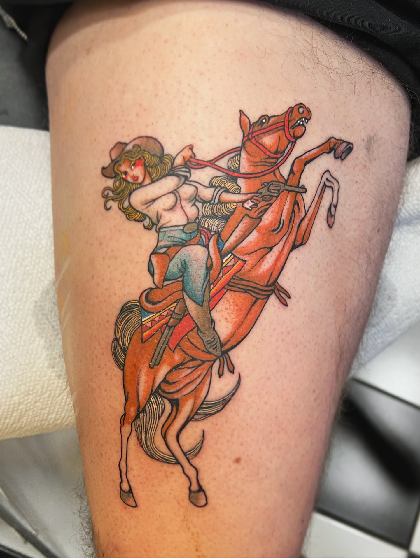 Cowgirl riding horse American traditional tattoo on the thigh by superteal