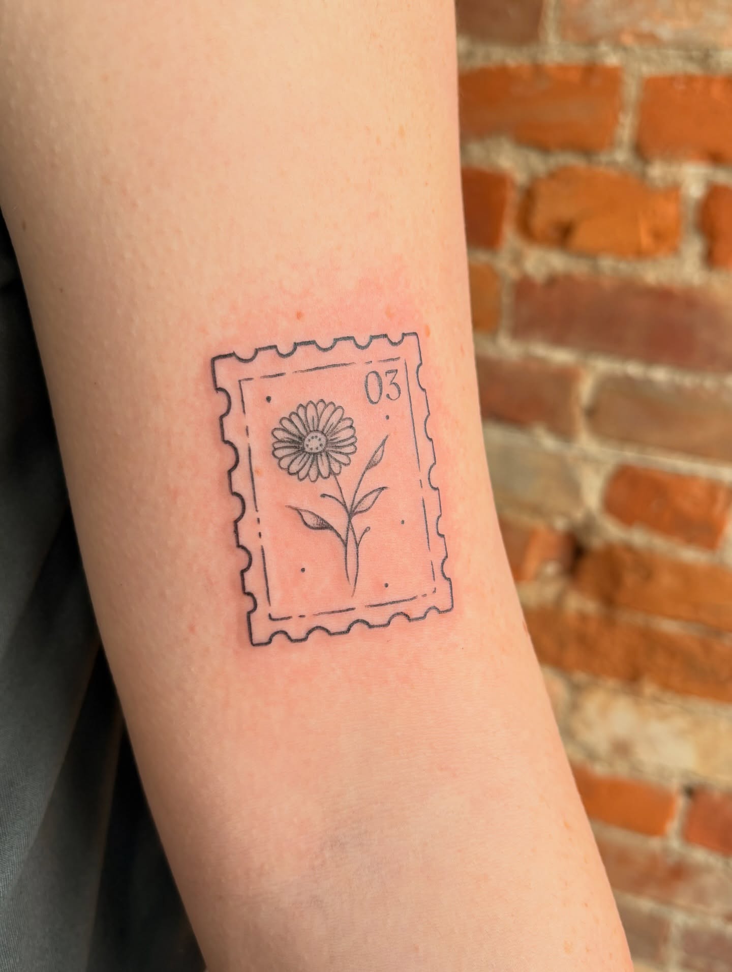 Flower postage stamp black and grey tattoo on the forearm by Jen Osborne ♡ Cincinnati Tattoo Artist