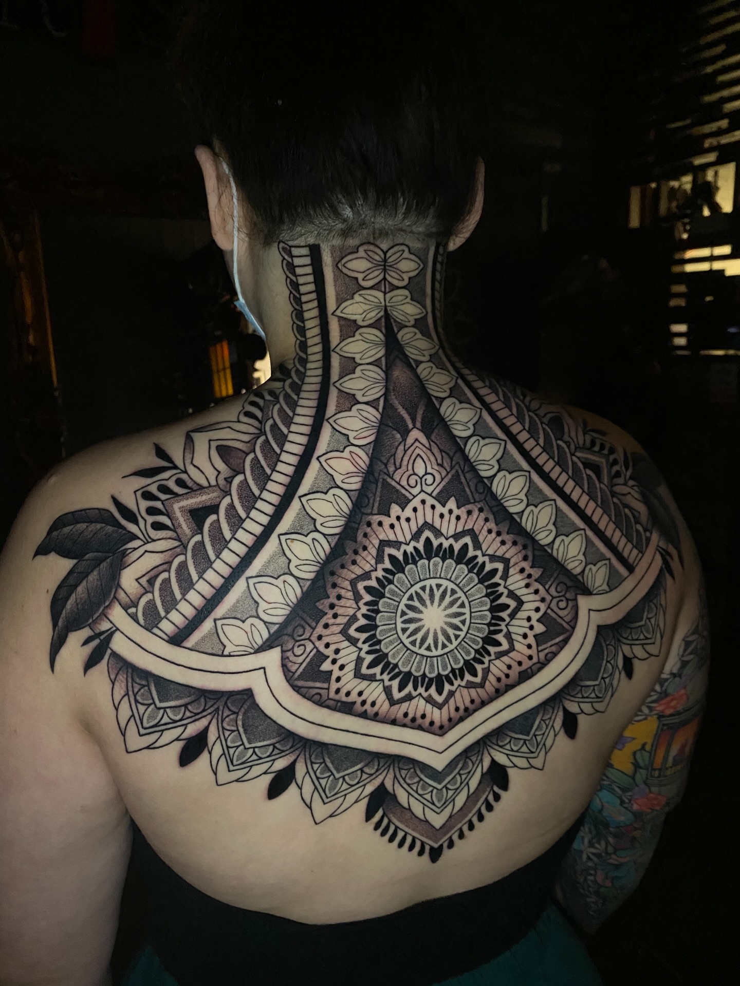 Mandala geometric tattoo on the back by Jason Call