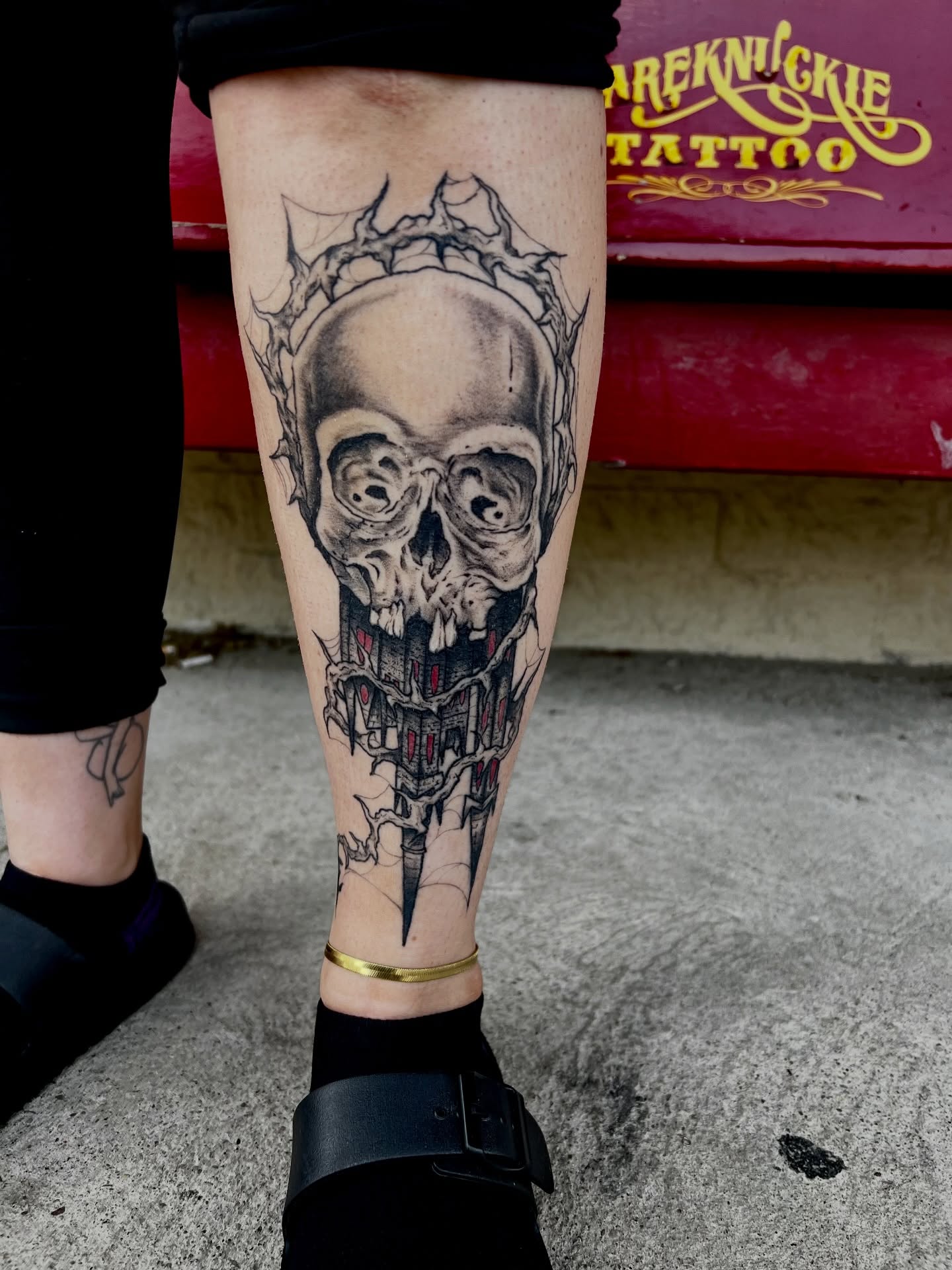Skull realism tattoo on the calf by Josh Kronauer