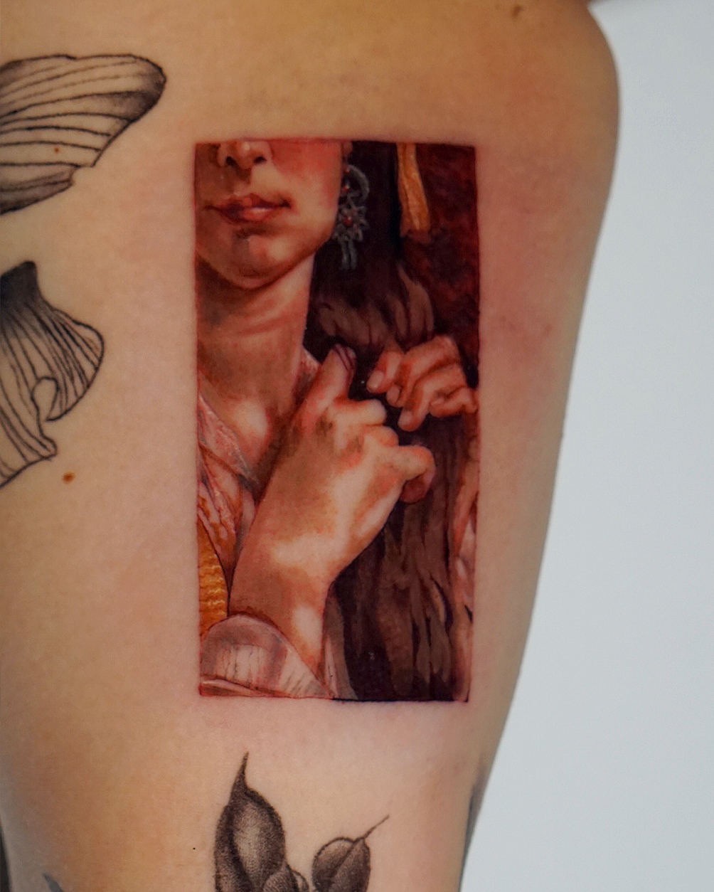Woman realism tattoo on the upper arm by San Diego Color Realism and Neotraditional
