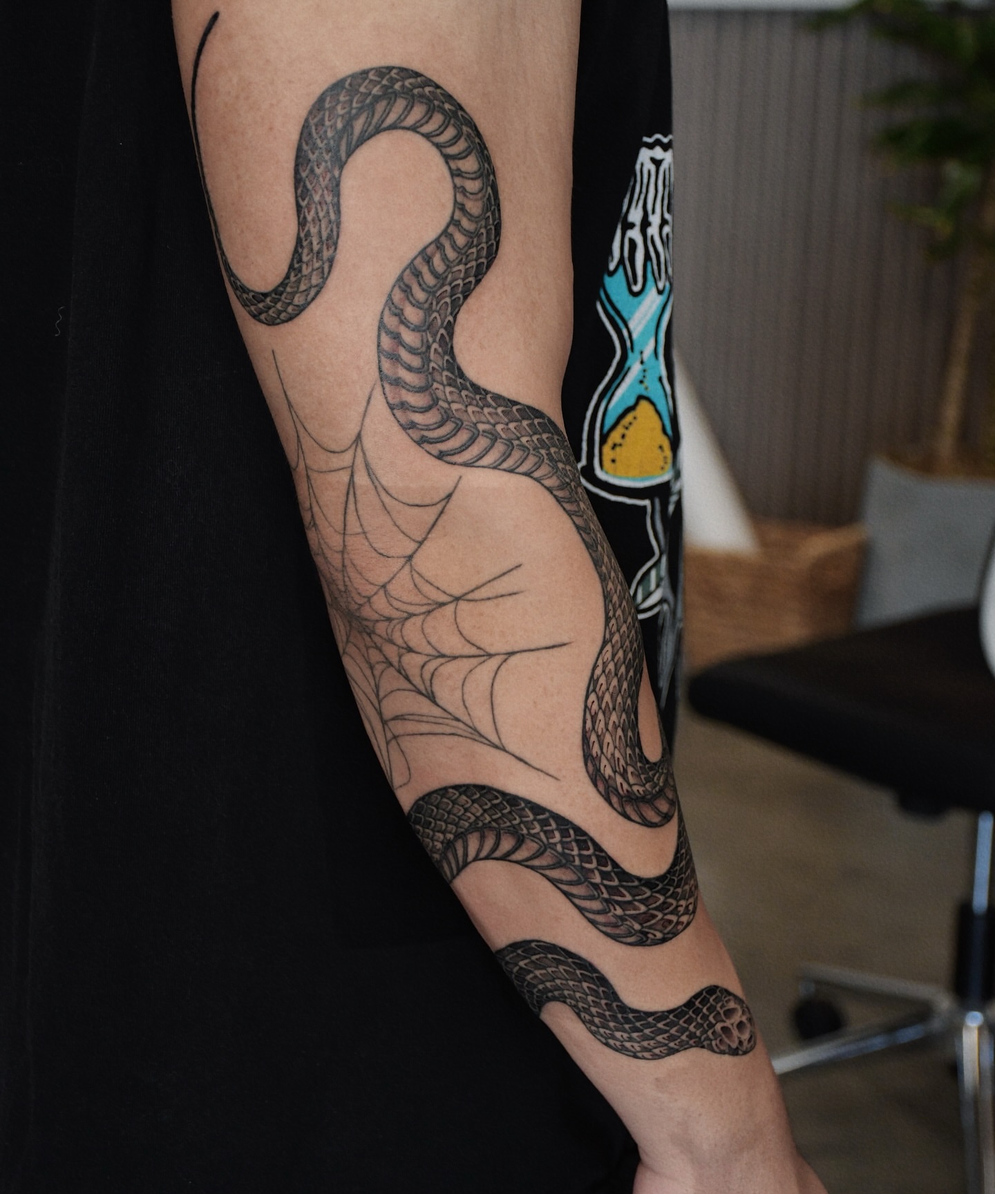 Snake black and grey tattoo on the forearm by Gary Zhong, Upland, California