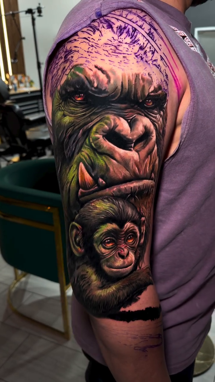 Gorilla and baby gorilla portrait realism tattoo on the upper arm by Guillermo Columbie, Houston, Texas