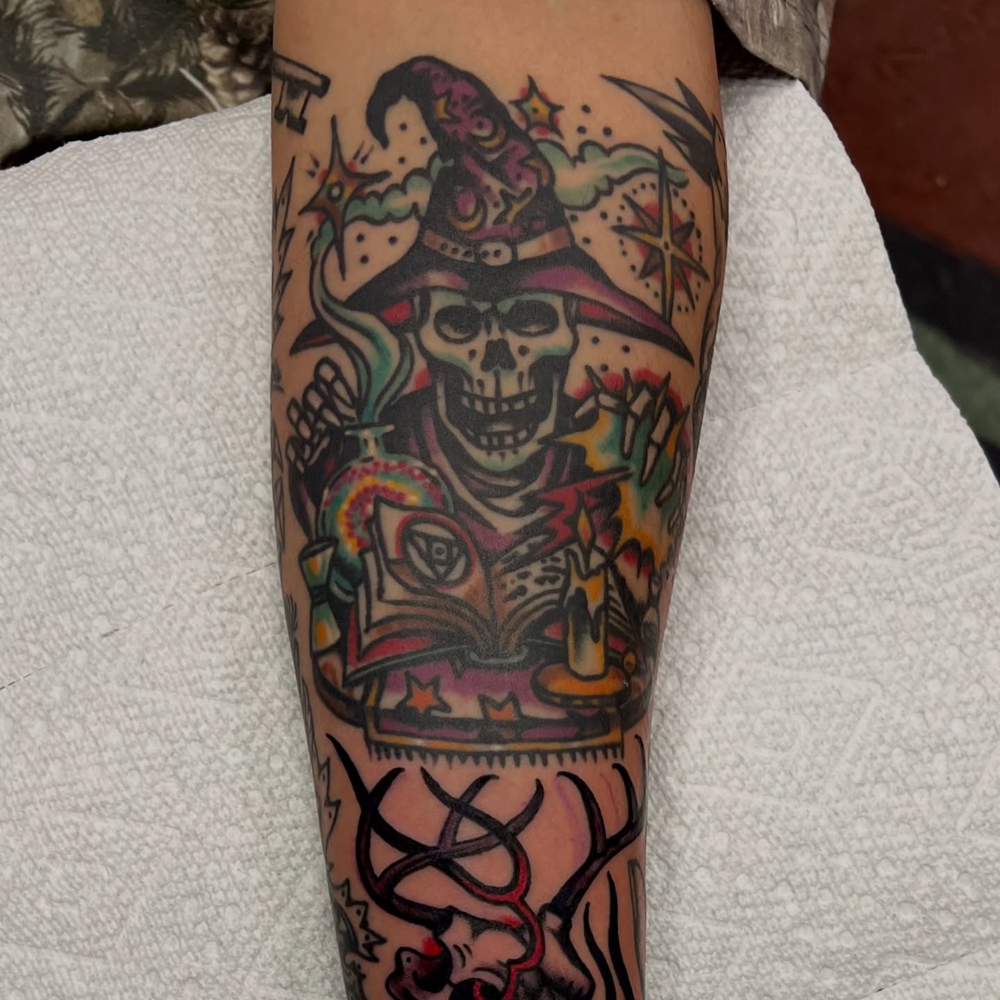Pirate skull reading book American traditional tattoo on the forearm by @brandonhuckabey, Denver, Colorado