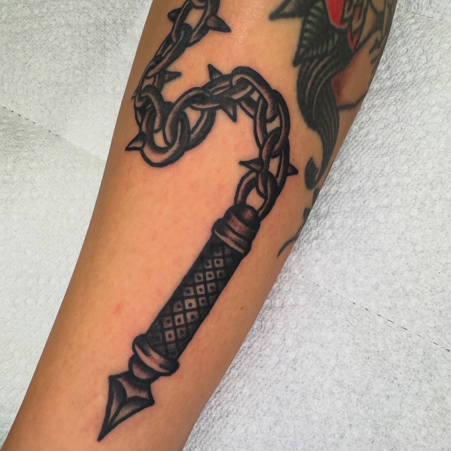 Chain and dagger American traditional tattoo on the forearm by Kenny Kastro