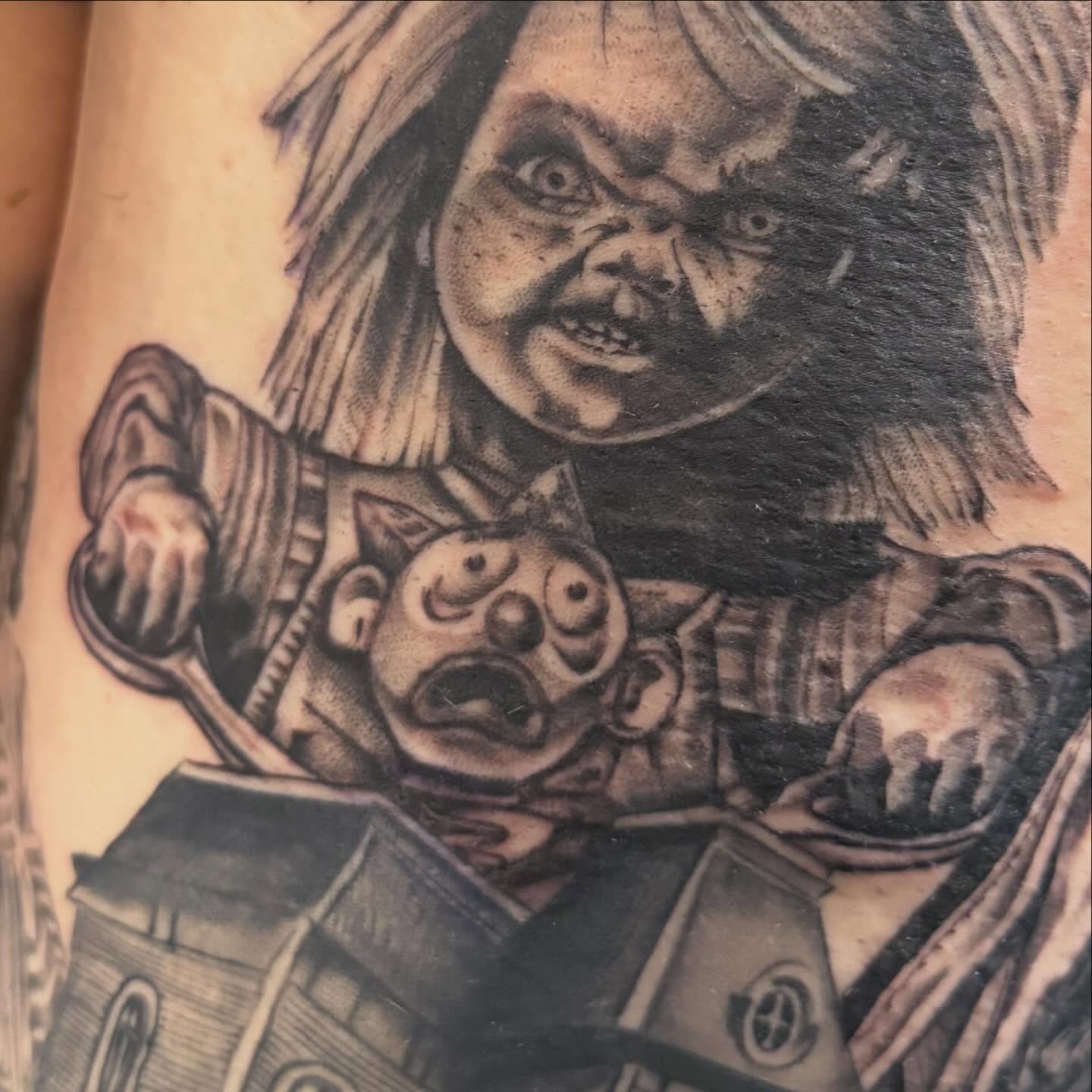 Chucky and doll realism tattoo on the forearm by Tina Gregg, North Ridgeville, Ohio