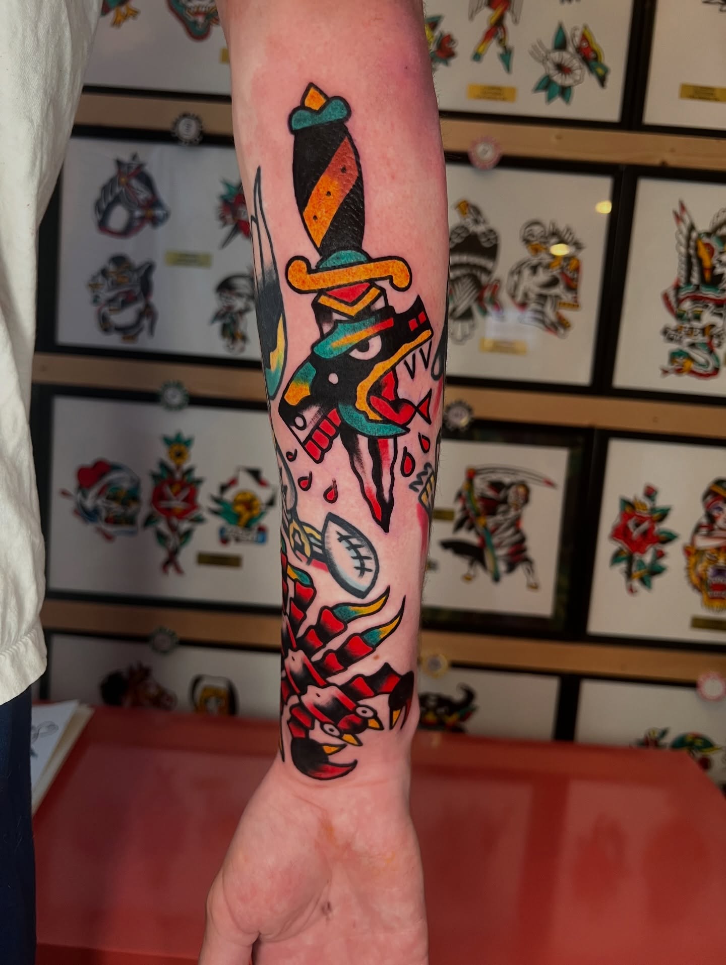 Bird and dagger American traditional tattoo on the forearm by Like A Horse Corral
