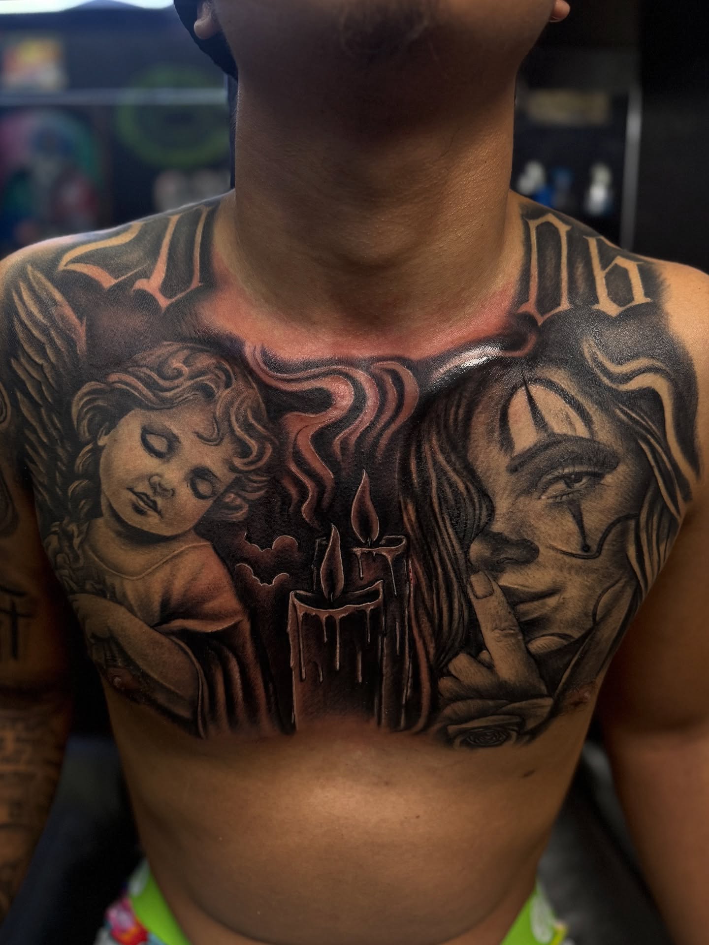 Angel, candle, jesus realism tattoo on the chest by @samg_tat2s, San Diego, California